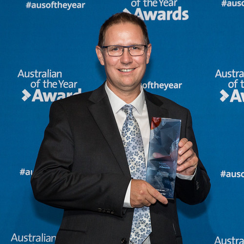 Dr Richard Harris holding his Australian of the Year award