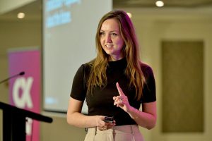 Jo Lepore presenting on stage