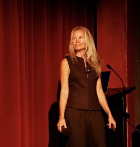 Jen Willis speaking on stage