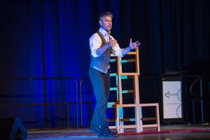 Dan Aubin presenting with a chair tower