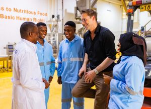 Felix Brooks-Church with his factory team in Tanzania