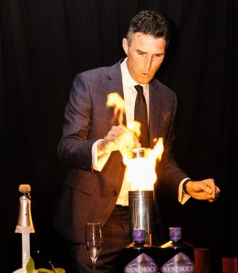 Performing a fire trick on stage