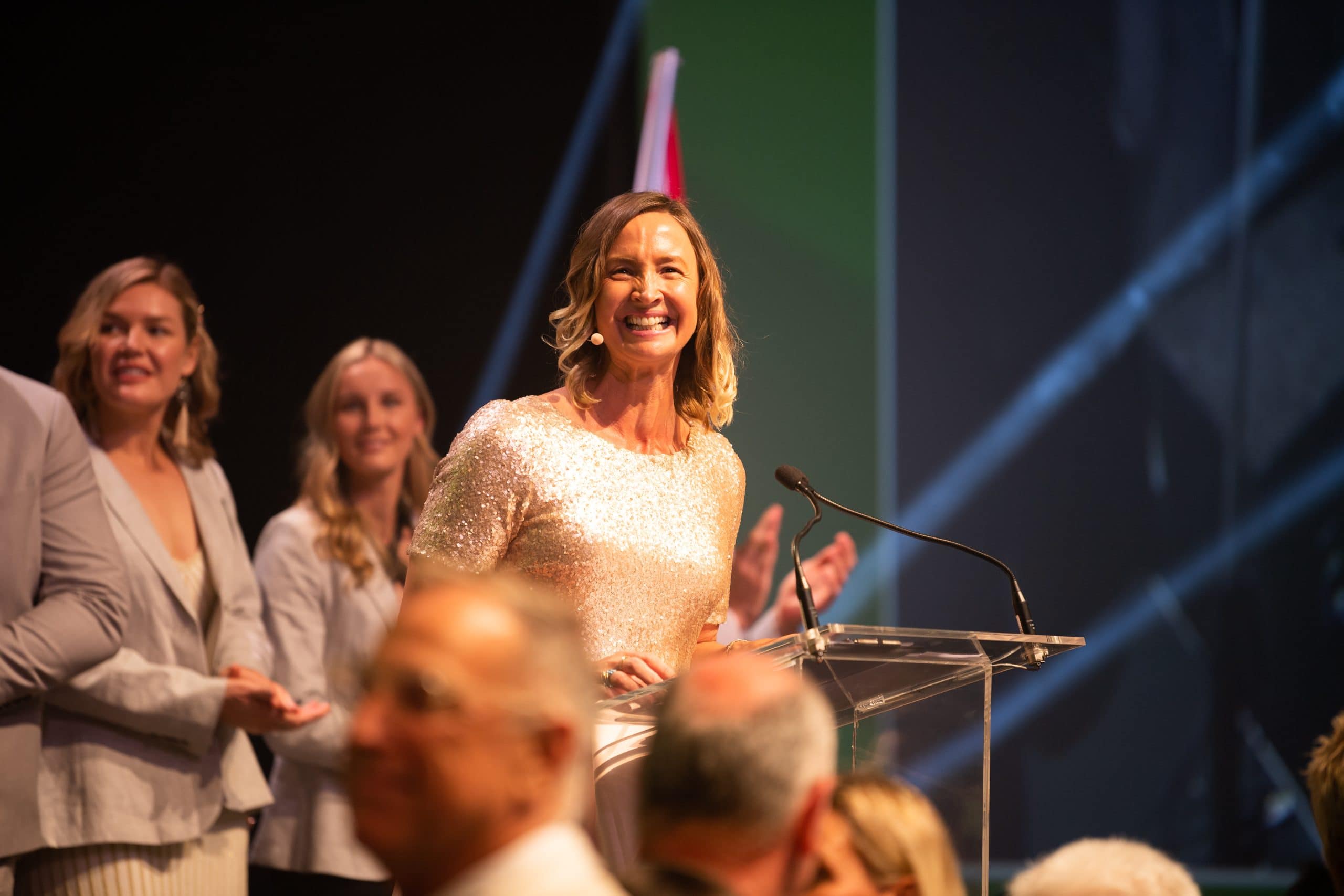Brooke Hanson MC'ing an Olympic dinner event