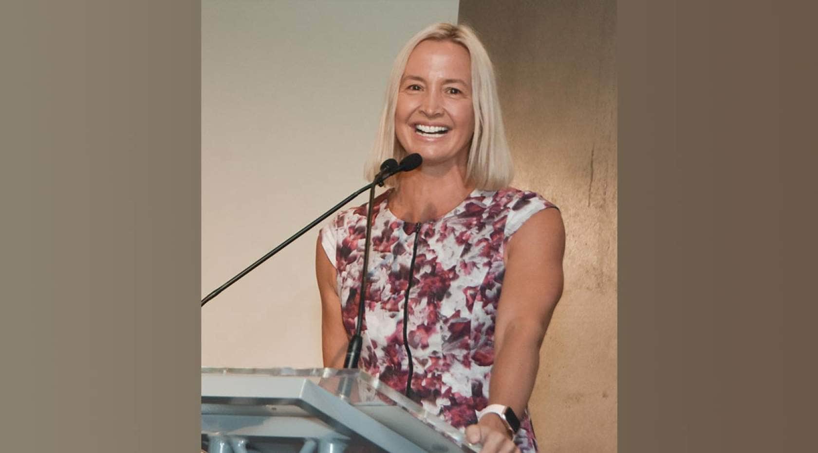 Brooke Hanson speaking at a corporate event