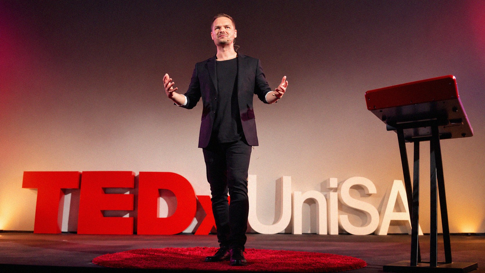 Dr Nathan Jones speaking on the TEDx stage