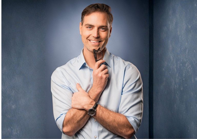 Studio portrait in a light blue shirt