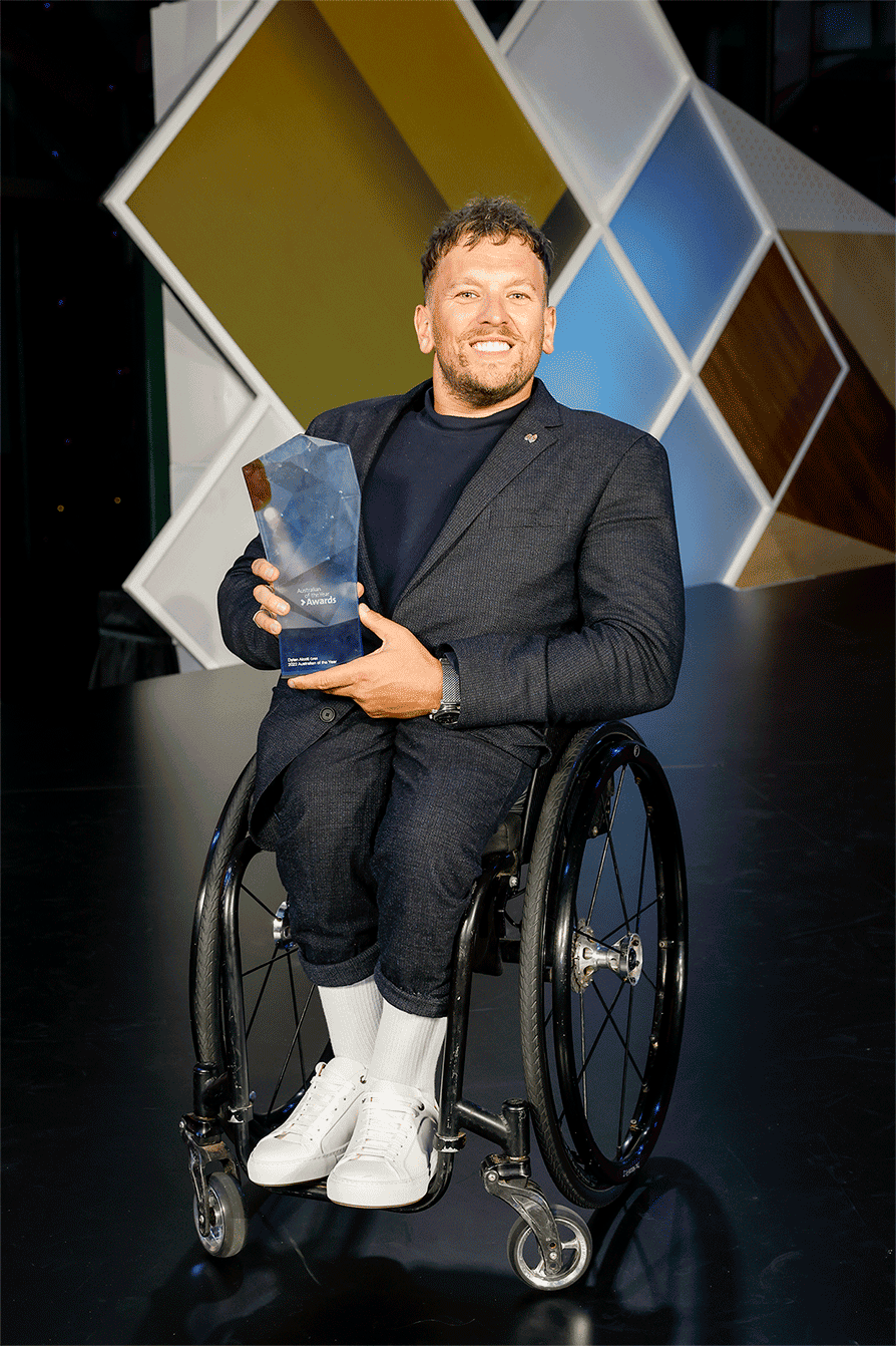 Dylan Alcott holding his Australian of the Year award