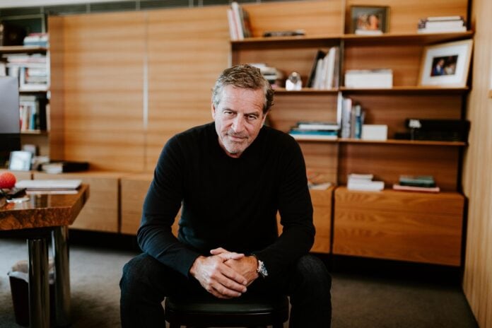 Seated in his office