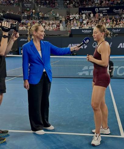 Interviewing a player courtside for Nine